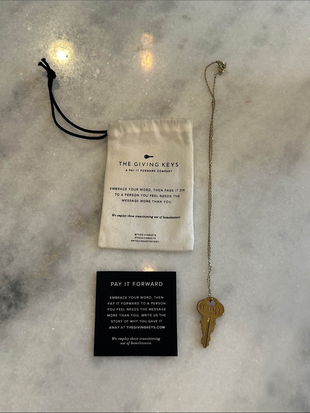The Giving Keys Gold Key Necklace with Branded Pouch